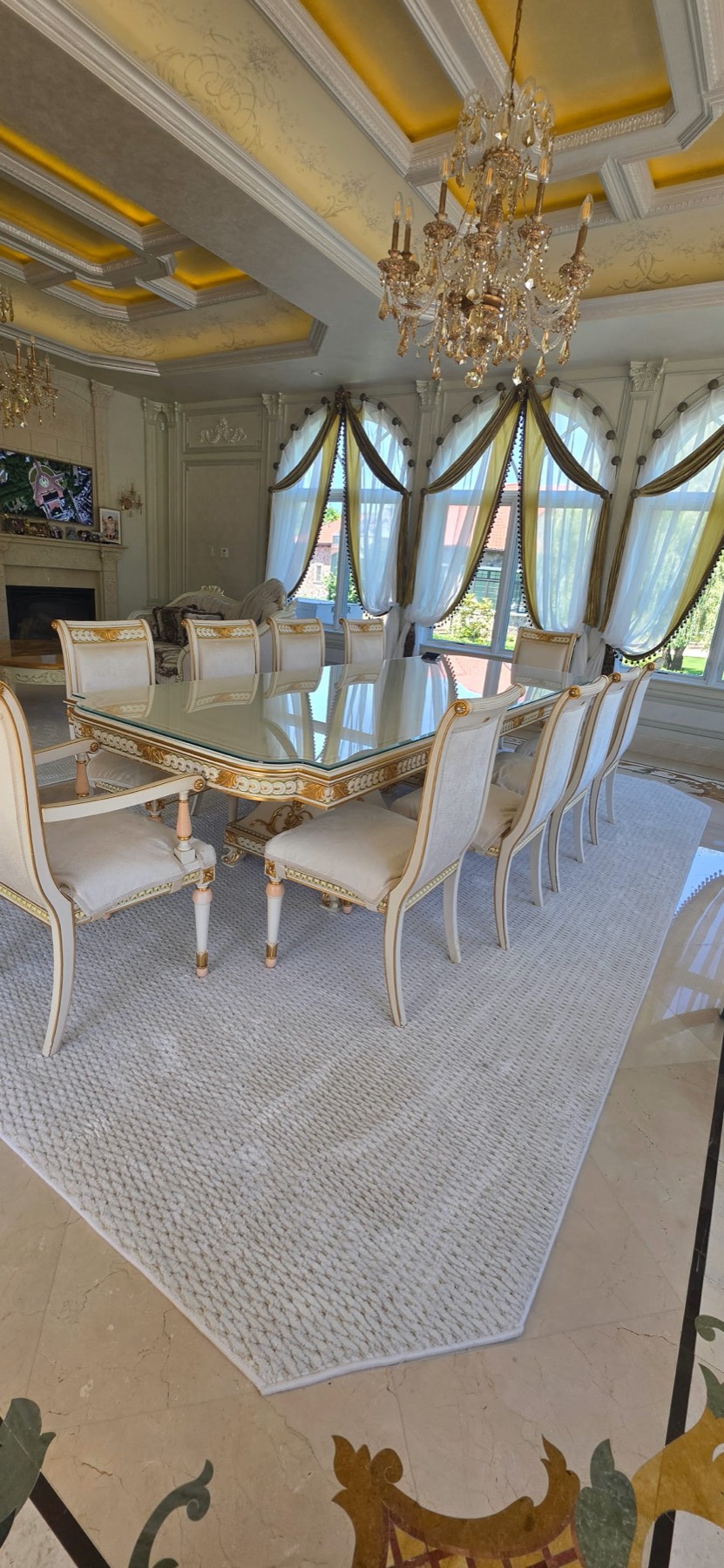 Custom octagonal area rug in a grand Merrick estate dining room