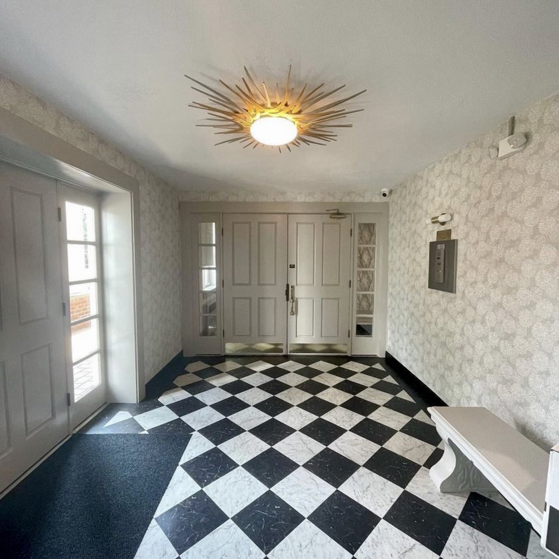 Checkerboard luxury vinyl tile entrance installation